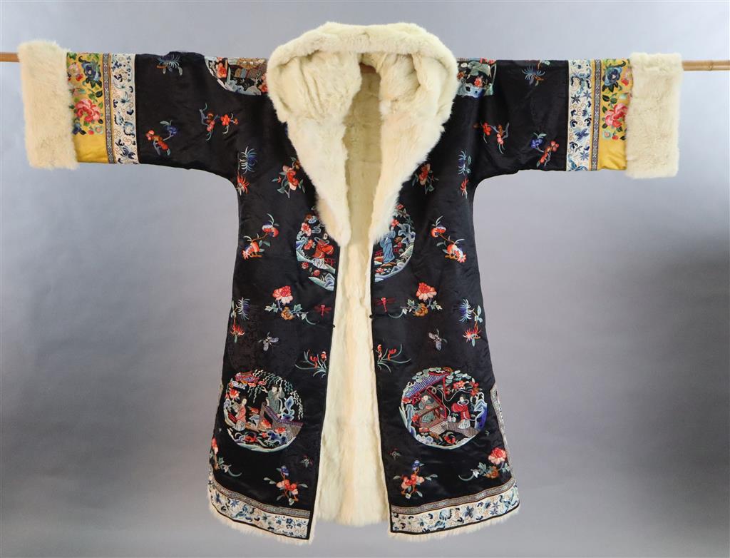 A Chinese silk embroidered winter robe, late 19th century/early 20th century, length 125cm